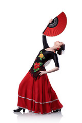 Image showing young woman dancing flamenco with fan isolated on white