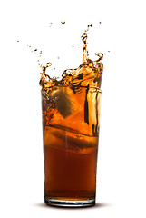 Image showing Beautiful splash of cola in glass isolated on white