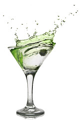 Image showing Green alcohol cocktail with splash isolated on white