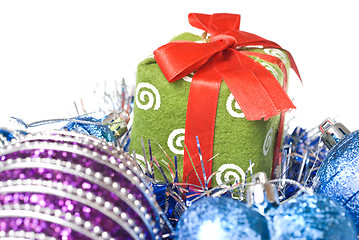 Image showing christmas balls with and gift with decoration isolated on white
