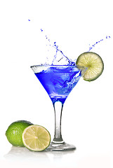 Image showing Blue cocktail with splash isolated on white