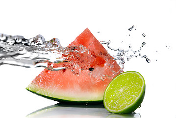 Image showing watermelon with lime and water splash isolated on white