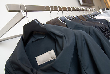 Image showing clothes on racks in store