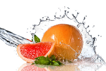 Image showing Water splash on grapefruit with mint isolated on white