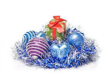 Image showing christmas balls with and gift with decoration isolated on white