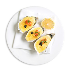 Image showing oysters with sauce and lemon