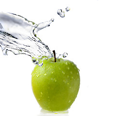 Image showing fresh water splash on green apple isolated on white