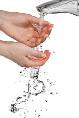 Image showing hands with pouring water isolated on white
