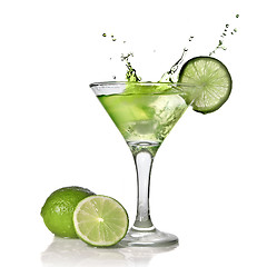 Image showing Green alchohol cocktail with splash and green lime isolated on w