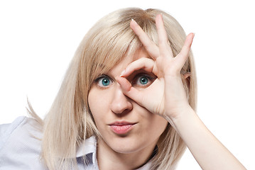 Image showing Attractive young woman and Ok sign isolated on white