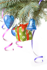 Image showing Christmas balls, gift and decoration on fir tree branch isolated