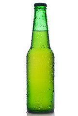 Image showing Green beer bottle with water drops isolated on white