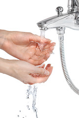 Image showing hands with pouring water isolated on white