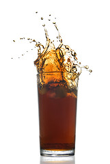 Image showing Beautiful splash of cola in glass isolated on white