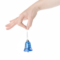 Image showing arm holding blue christmas bell isolated on white