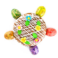 Image showing top view of easter eggs and cake isolated on white