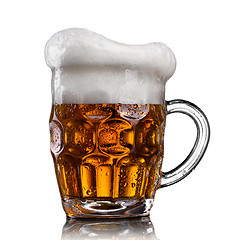 Image showing Beer in glass with water drops isolated on white 
