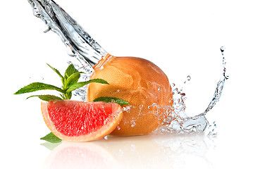 Image showing Water splash on grapefruit with mint isolated on white