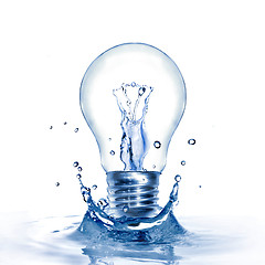 Image showing Energy concept. Light bulb with water and splash isolated on whi