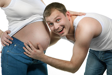 Image showing Happy smiling man with pregnant woman isolated on white