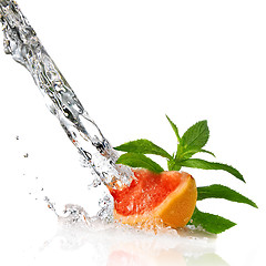 Image showing Water splash on grapefruit with mint isolated on white