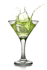 Image showing Green alcohol cocktail with splash isolated on white