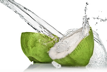 Image showing Green coconut with water splash isolated on white