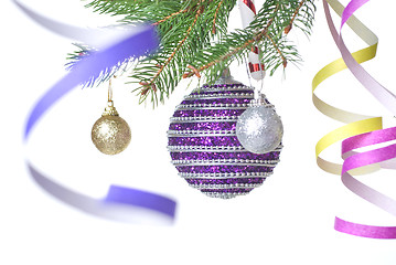 Image showing Christmas balls and decoration on fir tree branch isolated on wh