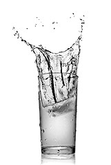 Image showing water splash in glass isolated on white