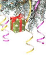 Image showing Christmas gift and decoration on fir tree branch isolated on whi