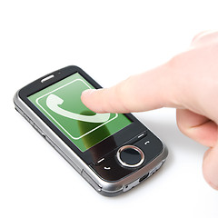 Image showing finger and pda with incoming call isolated on white