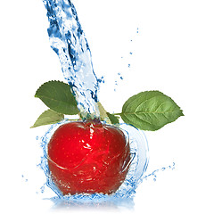 Image showing red apple with leaves and water splash isolated on white 