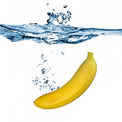 Image showing banana dropped into water isolated on white