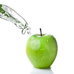 Image showing fresh water splash on green apple isolated on white