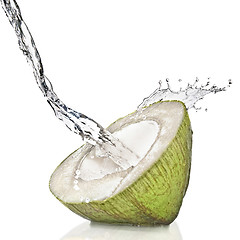 Image showing fresh cut green coconut on white splashing