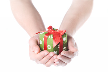 Image showing Hands holding gift isolated on white