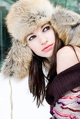 Image showing winter portrait of young woman in fur hat