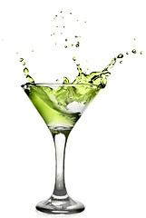 Image showing Green alcohol cocktail with splash isolated on white