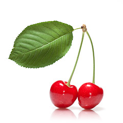 Image showing red cherry with leaf isolated on white