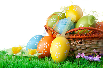 Image showing color easter eggs with green grass on the white
