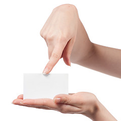 Image showing Woman hand holding empty visiting card and pointing on it isolat