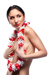 Image showing Sexy woman with garland from flowers isolated on white