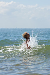 Image showing boy playing in the sea