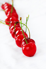 Image showing Appetizing red cherries row