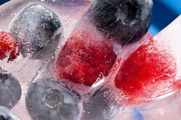 Image showing Raspberry and blackberry frozen in ice sticks