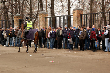 Image showing Mounted Policewoman and Soccer Fans