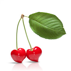 Image showing red cherry in shape of heart with leaf isolated on white