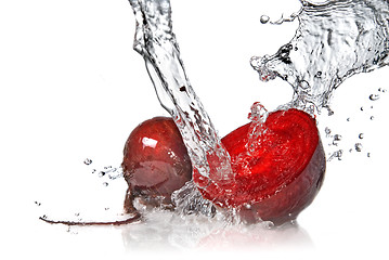 Image showing red beet with water splash isolated on white