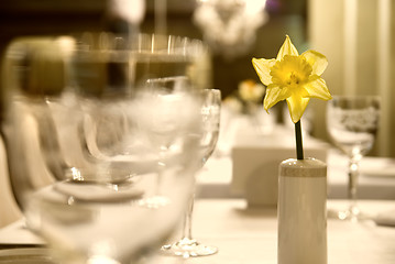 Image showing Glass goblets with flower on the table