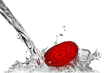 Image showing red beet with water splash isolated on white